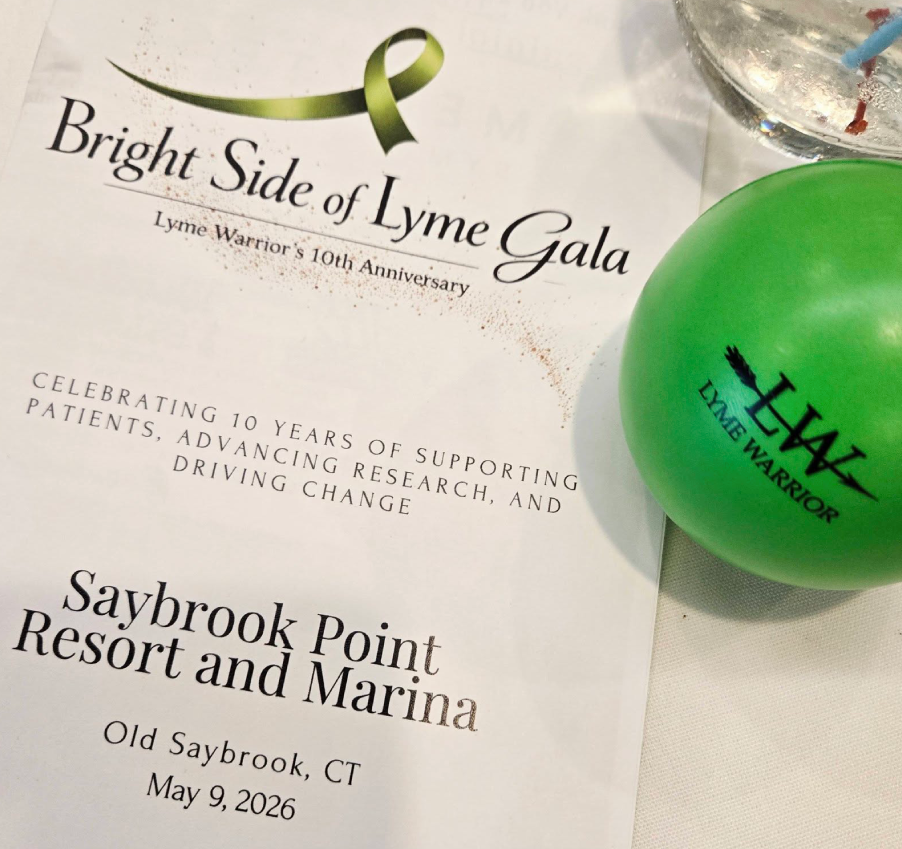 Lyme Warrior 10th Anniversary Gala program and green Lyme Warrior stress ball on event table at Saybrook Point Resort in Connecticut