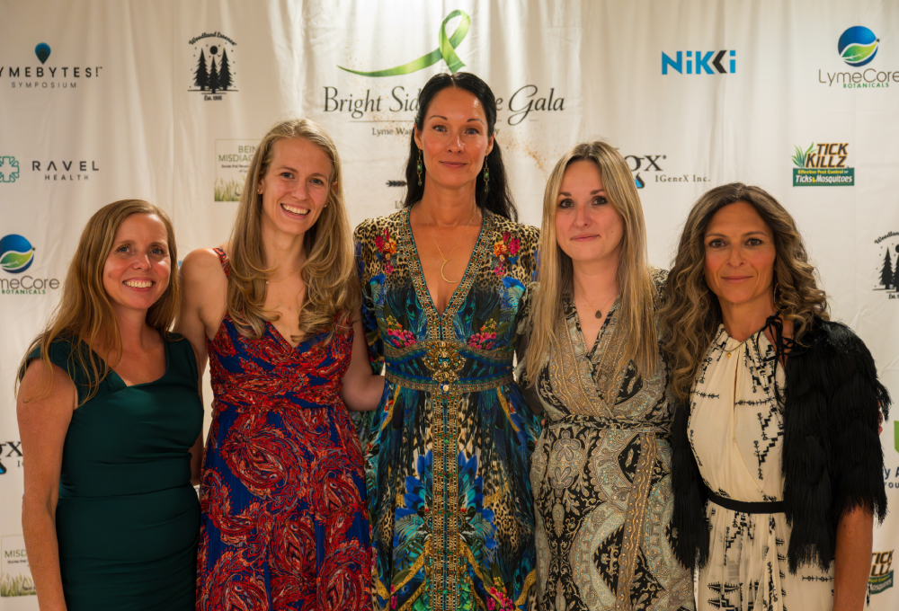 Dr. Myriah Hinchey posing with friends at Lyme community event