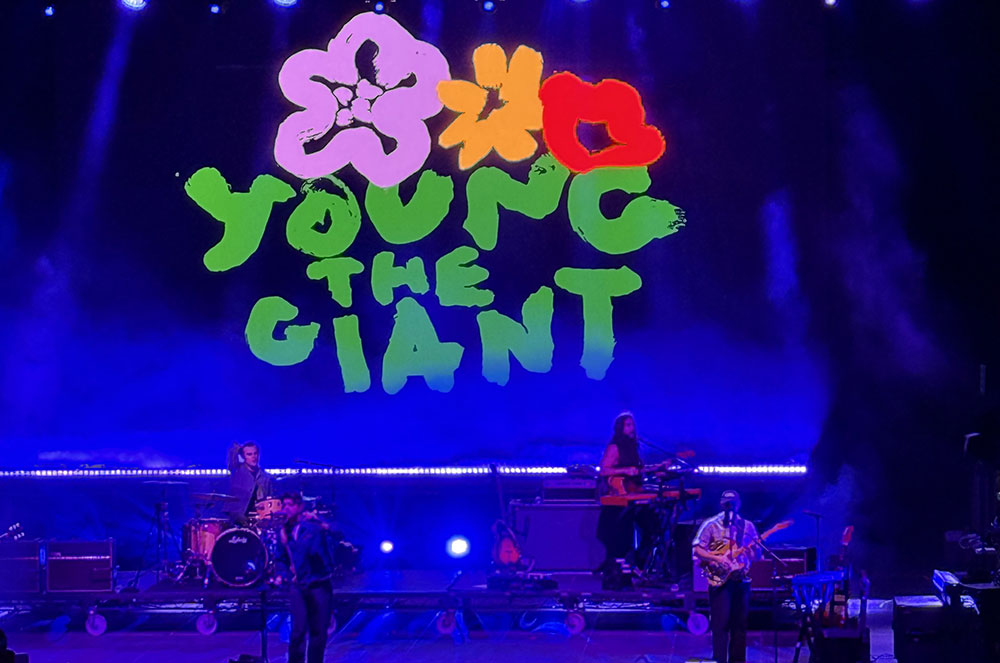Music for Action Brings Lyme Disease Awareness to Central Park with Young the Giant & St. Lucia 1 Young the Giant performing under blue stage lights at the Music for Action Lyme disease awareness concert at SummerStage in Central Park