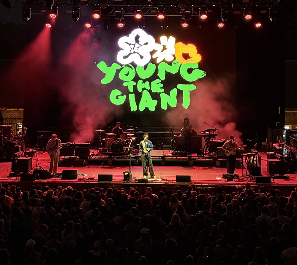 Music for Action Brings Lyme Disease Awareness to Central Park with Young the Giant & St. Lucia 17 Young the Giant performing under red stage lights before the crowd at the Music for Action Lyme disease awareness concert