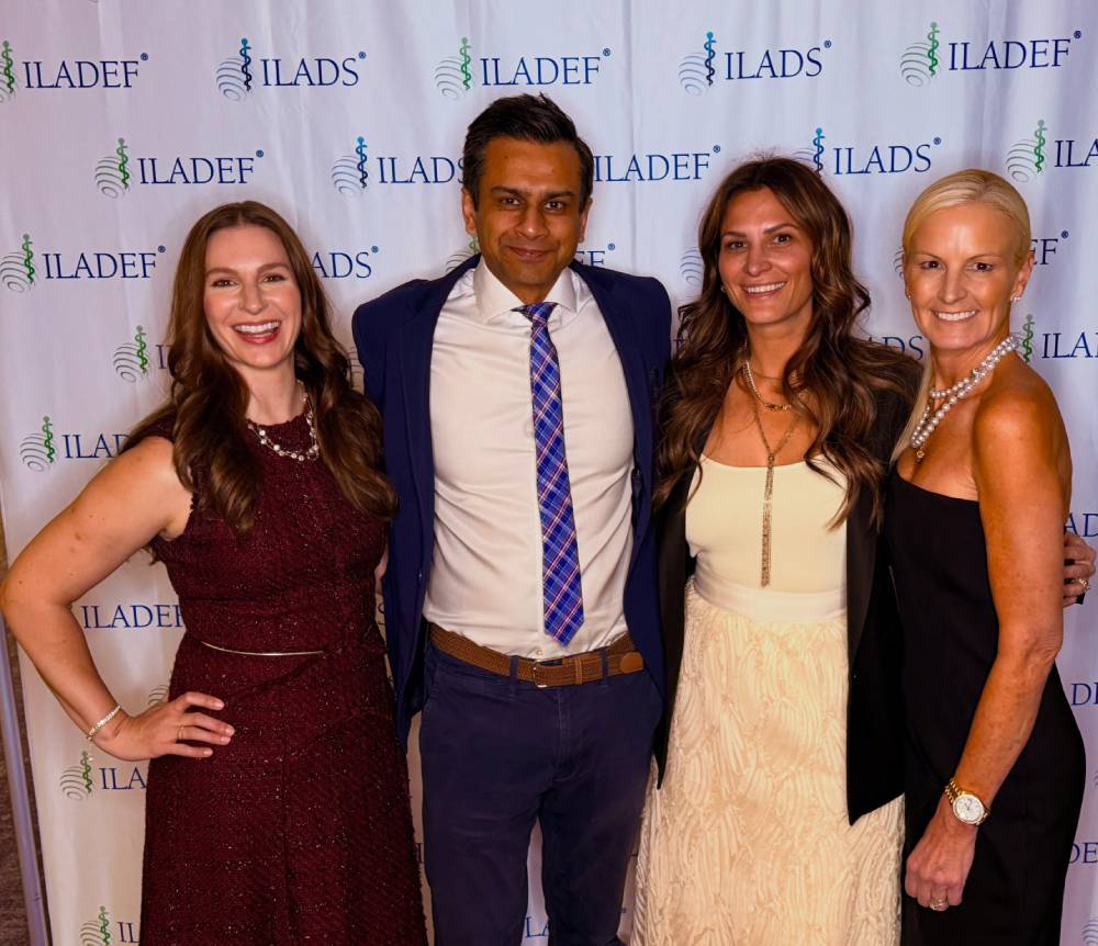 Tick Boot Camp at ILADS 2026: Official Podcast & Gala Emcees 14 Ashok Gupta and colleagues at the ILADS conference backdrop.
