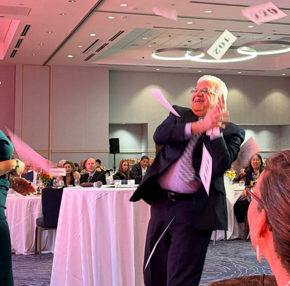 Tick Boot Camp at ILADS 2026: Official Podcast & Gala Emcees 19 Auction cards tossed into the air during a special giveaway at the ILADEF Gala.
